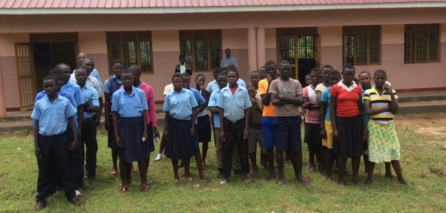 Students in front of phase 1 of community secondary school in Butta, Uganda